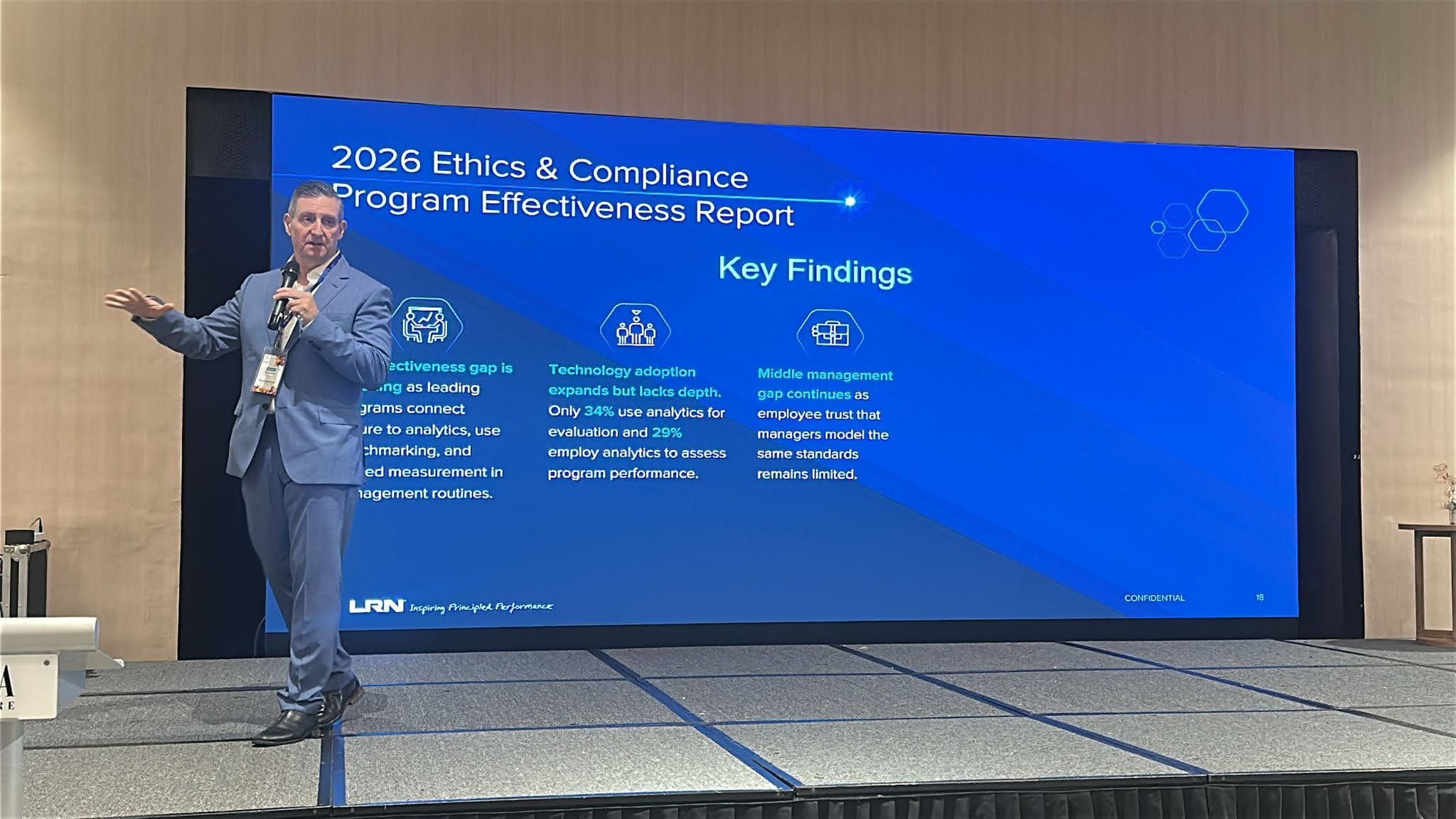 Ty Francis presenting an ethics and compliance report