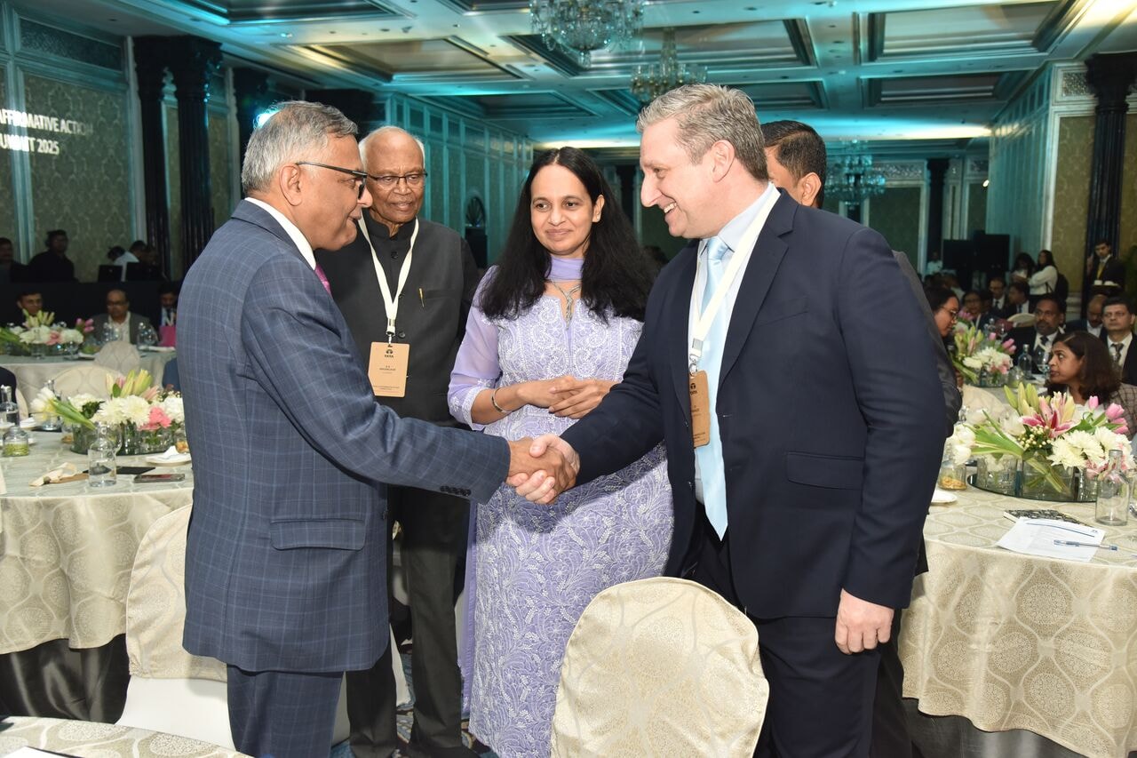 Ty Francis meeting leaders at a formal event